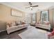 Bright living room with hardwood floors, a ceiling fan, and comfortable seating at 3834 Sipes Ln, Charlotte, NC 28269