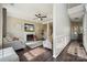 Cozy living room featuring hardwood floors, a fireplace, and neutral decor at 3834 Sipes Ln, Charlotte, NC 28269