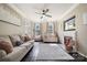 Bright living room with a fireplace, ceiling fan, and neutral decor at 3834 Sipes Ln, Charlotte, NC 28269