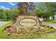 Water's Edge community entrance sign with landscaping at 408 Spring Gardens Dr, Belmont, NC 28012