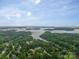 Aerial view of lakefront community with lush greenery at 4150 Summit Ridge Ln, Denver, NC 28037