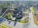 An aerial view showcasing home on an oversized lot that backs up to a wooded community common open space at 4150 Summit Ridge Ln, Denver, NC 28037