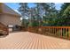 Spacious back deck with built-in outdoor grill and lush green landscaping surrounding at 4150 Summit Ridge Ln, Denver, NC 28037