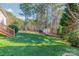 Landscaped backyard with storage shed and fence at 4150 Summit Ridge Ln, Denver, NC 28037