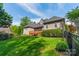 Expansive backyard featuring a well-maintained lawn, wooden deck, and lush landscaping at 4150 Summit Ridge Ln, Denver, NC 28037