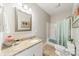 Clean bathroom with granite countertop and a shower/tub combo at 4150 Summit Ridge Ln, Denver, NC 28037