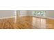 A large bedroom with hardwood floors and large window at 4150 Summit Ridge Ln, Denver, NC 28037