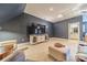 Versatile bonus room with a large TV and access to a bathroom at 4150 Summit Ridge Ln, Denver, NC 28037