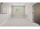 Bonus room with neutral carpet, white walls, and plenty of natural light at 4150 Summit Ridge Ln, Denver, NC 28037