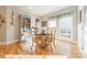 Bright breakfast nook with hardwood floors and built-in shelving at 4150 Summit Ridge Ln, Denver, NC 28037