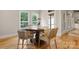 Cozy breakfast nook with hardwood floors, round table, and natural light at 4150 Summit Ridge Ln, Denver, NC 28037