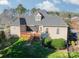 Two story house with large deck and landscaped yard at 4150 Summit Ridge Ln, Denver, NC 28037