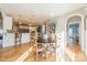Kitchen features white cabinetry, breakfast bar, and light-blue tile backsplash at 4150 Summit Ridge Ln, Denver, NC 28037
