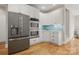 Gourmet kitchen boasts stainless steel appliances, double ovens, and a lovely backsplash at 4150 Summit Ridge Ln, Denver, NC 28037