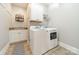 Convenient laundry room with washer, dryer, and cabinets at 4150 Summit Ridge Ln, Denver, NC 28037
