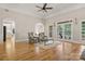 Spacious living room featuring hardwood floors, neutral colors, fireplace, and natural light at 4150 Summit Ridge Ln, Denver, NC 28037
