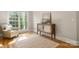 Cozy reading spot with hardwood floors, neutral colored walls and a comfortable armchair at 4150 Summit Ridge Ln, Denver, NC 28037