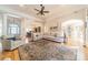 Spacious living room with hardwood floors, large sectional sofa, and access to kitchen at 4150 Summit Ridge Ln, Denver, NC 28037