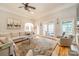 Bright living room with hardwood floors, sectional sofa, and French doors leading to patio at 4150 Summit Ridge Ln, Denver, NC 28037
