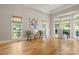 Bright, naturally lit living room, hardwood floors, and large windows at 4150 Summit Ridge Ln, Denver, NC 28037