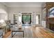 Bright living room with hardwood floors and a screened-in porch at 4150 Summit Ridge Ln, Denver, NC 28037