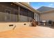 Outdoor kitchen on wooden deck featuring stainless steel BBQ and stone detailing at 4150 Summit Ridge Ln, Denver, NC 28037