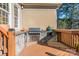 Outdoor kitchen with grill and stone counters at 4150 Summit Ridge Ln, Denver, NC 28037