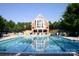 Community swimming pool with clubhouse in background at 4150 Summit Ridge Ln, Denver, NC 28037