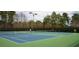 Outdoor tennis courts surrounded by trees offering a great recreational space at 4150 Summit Ridge Ln, Denver, NC 28037