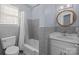 Updated bathroom with gray tile, a white vanity, and a shower/tub combo at 44339 Us 52 N Hwy, Richfield, NC 28137
