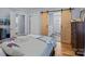 Charming bedroom with barn doors leading to the bathroom at 44339 Us 52 N Hwy, Richfield, NC 28137