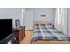 Simple bedroom with hardwood floors and a flat-screen TV at 44339 Us 52 N Hwy, Richfield, NC 28137