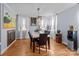 Bright dining room features hardwood floors, marble top table, and neutral decor at 44339 Us 52 N Hwy, Richfield, NC 28137