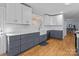 Updated kitchen with white and gray cabinets, quartz countertops, and farmhouse sink at 44339 Us 52 N Hwy, Richfield, NC 28137