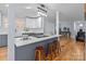 Renovated kitchen with island, stainless steel appliances, and white and gray cabinets at 44339 Us 52 N Hwy, Richfield, NC 28137