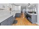Modern kitchen with white and gray cabinets, quartz countertops, and a farmhouse sink at 44339 Us 52 N Hwy, Richfield, NC 28137