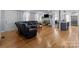 Open living room features hardwood floors, fireplace, and a large sectional sofa at 44339 Us 52 N Hwy, Richfield, NC 28137