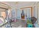 Sunroom with grey flooring, wicker furniture, and access to the backyard at 44339 Us 52 N Hwy, Richfield, NC 28137