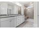 Bathroom with double vanity, granite countertop, and a large shower at 5007 Grand Champion Ct, Iron Station, NC 28080