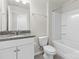 Clean bathroom with tub, single vanity, and granite top at 5007 Grand Champion Ct, Iron Station, NC 28080
