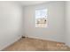 Bright bedroom with neutral walls, carpet, and window at 5007 Grand Champion Ct, Iron Station, NC 28080
