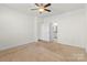 Bright bedroom with ceiling fan and access to bathroom at 5007 Grand Champion Ct, Iron Station, NC 28080