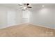 Large bedroom with ceiling fan and neutral carpeting at 5007 Grand Champion Ct, Iron Station, NC 28080
