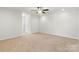 Bright bedroom with ceiling fan and neutral carpeting at 5007 Grand Champion Ct, Iron Station, NC 28080