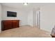 Bedroom with dresser, closet, and neutral carpeting at 5007 Grand Champion Ct, Iron Station, NC 28080