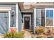 Inviting front door entrance with wreath and landscaping at 5007 Grand Champion Ct, Iron Station, NC 28080