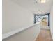 Upstairs hallway with window and carpeting at 5007 Grand Champion Ct, Iron Station, NC 28080