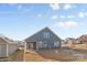 Gray house exterior with covered patio and backyard at 5007 Grand Champion Ct, Iron Station, NC 28080