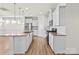 Modern kitchen with white cabinets, granite countertops and island at 5007 Grand Champion Ct, Iron Station, NC 28080
