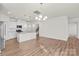 Open concept kitchen with island and stainless steel appliances at 5007 Grand Champion Ct, Iron Station, NC 28080